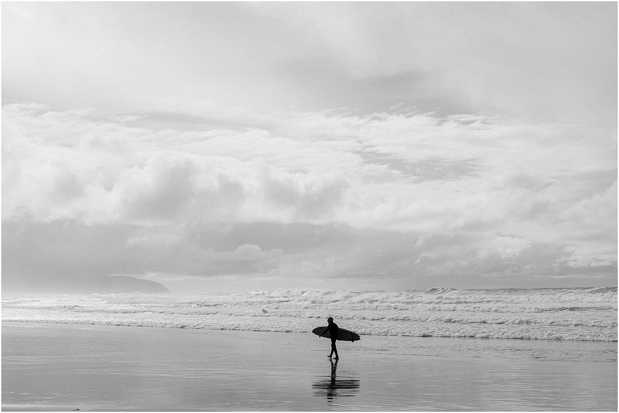 Cape Kiwanda surfer walking on the beach