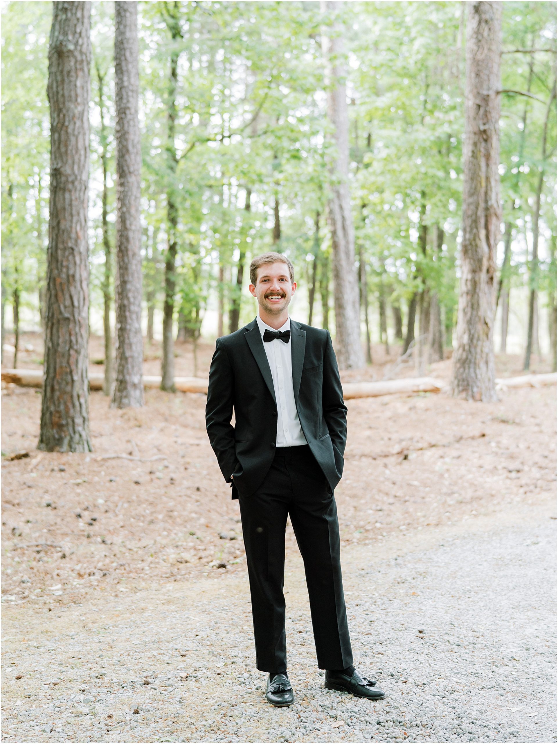Groom standing for a portrait.