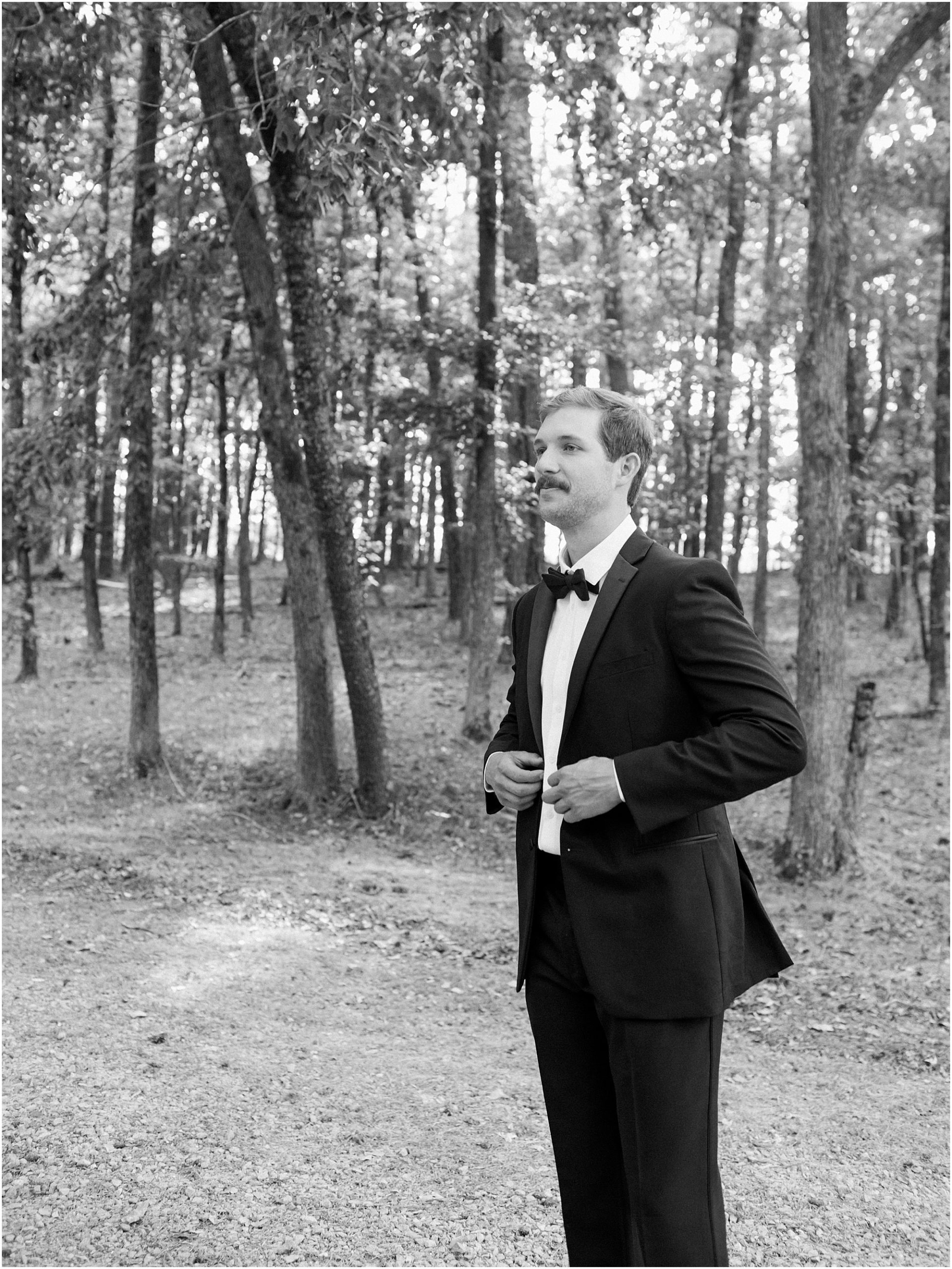 Black and white portrait of the groom.
