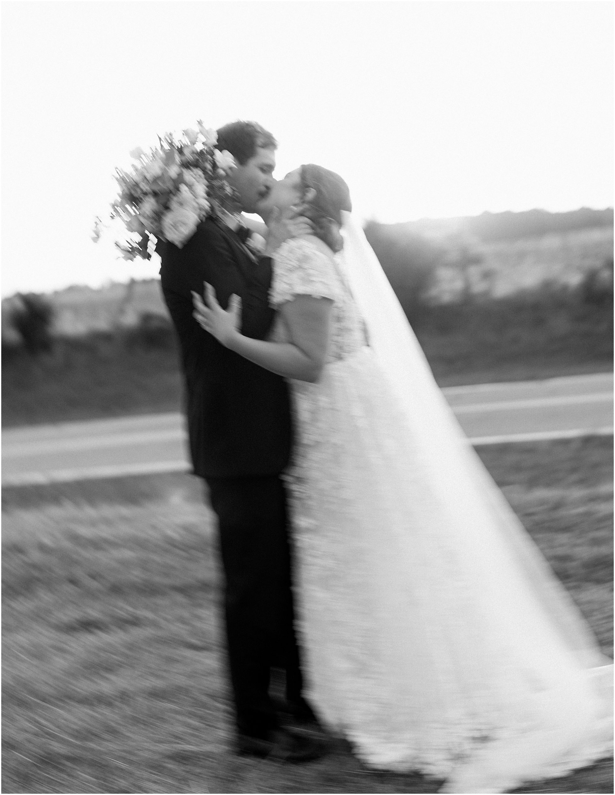 Bride and groom portraits in black and white. Bride and groom blurry.