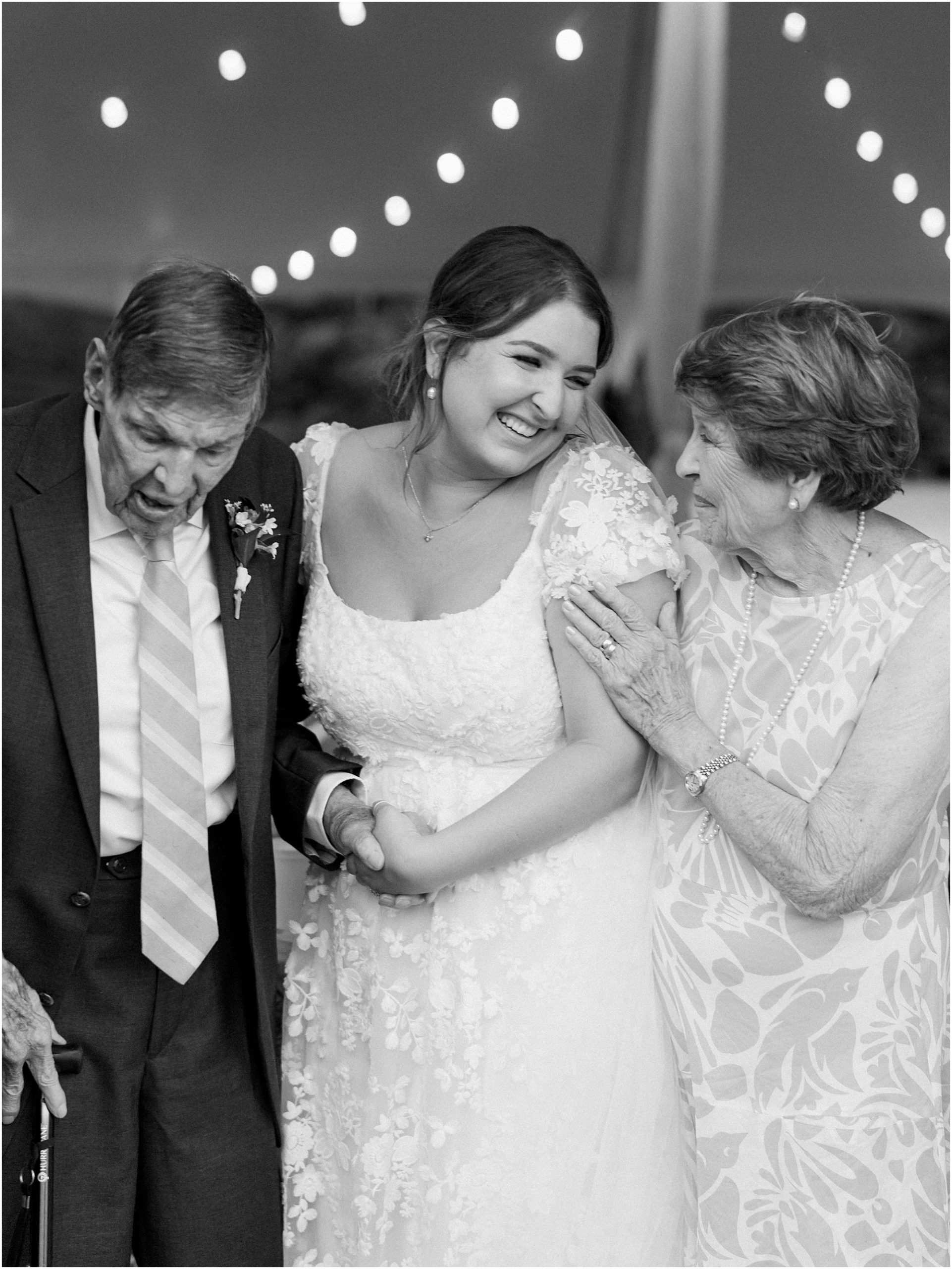 Bride with her family in black and white.