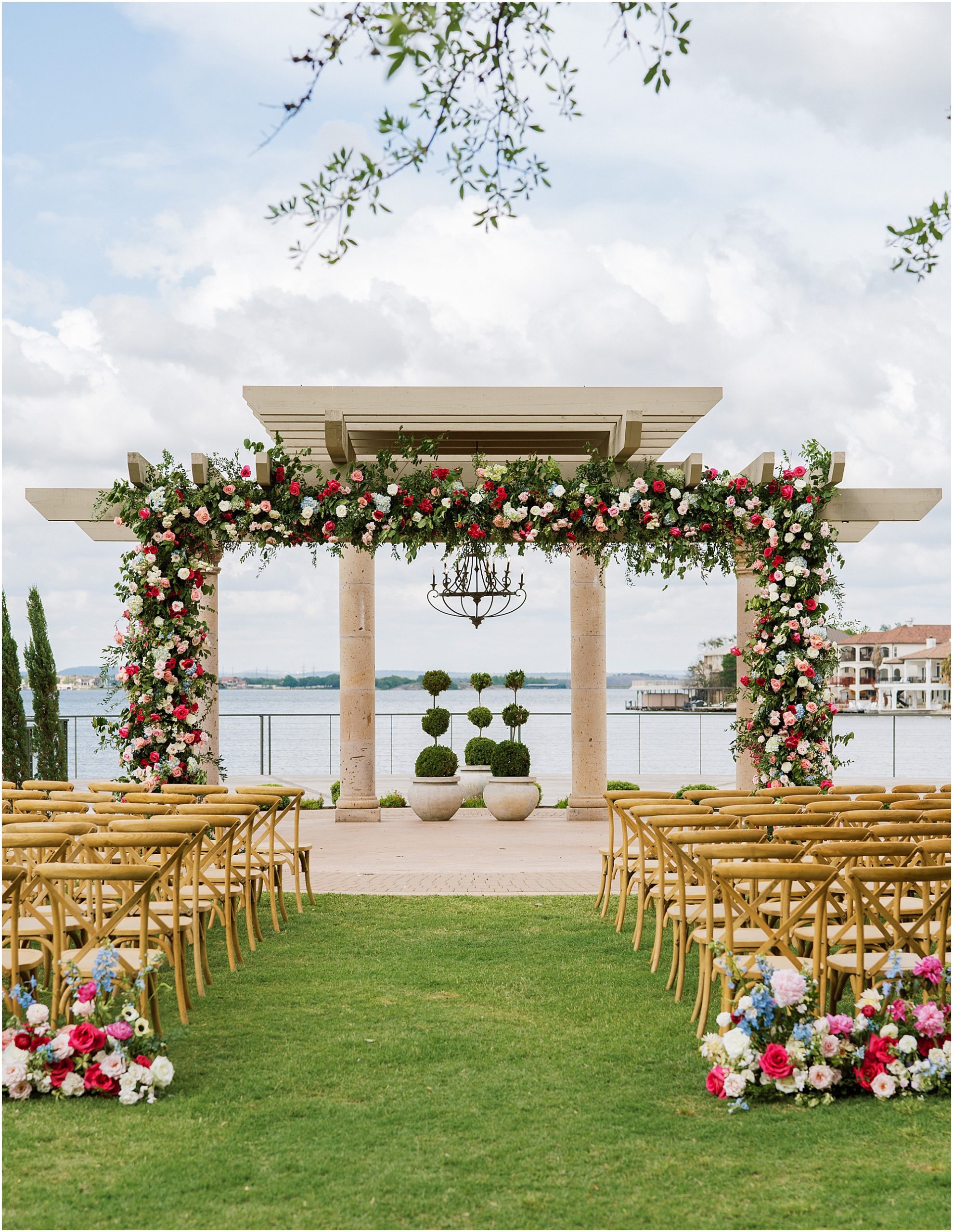 Colorful flowers all over the ceremony site by Stems of ATX.
