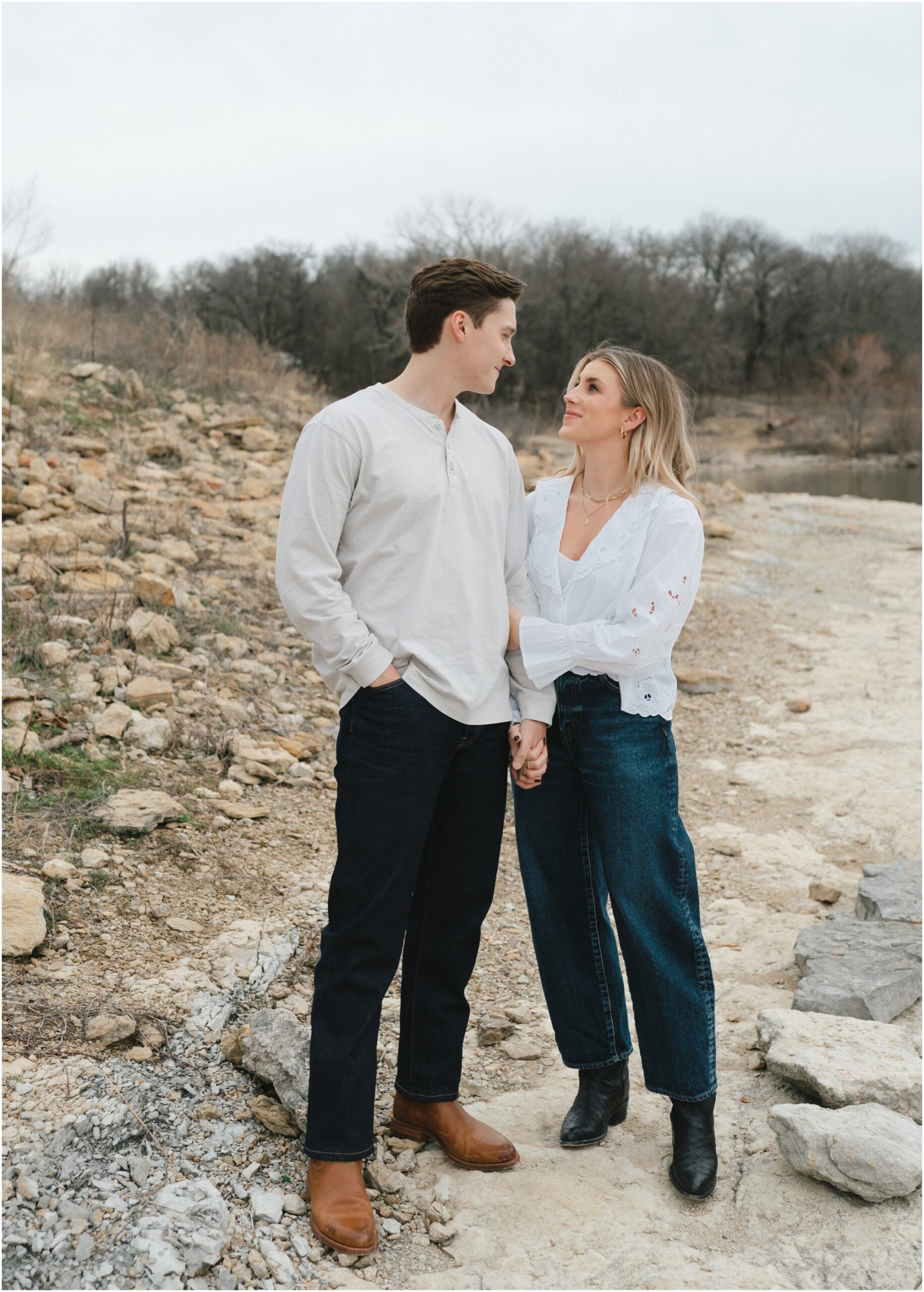 couple looking at each other in fort worth texas engagement session