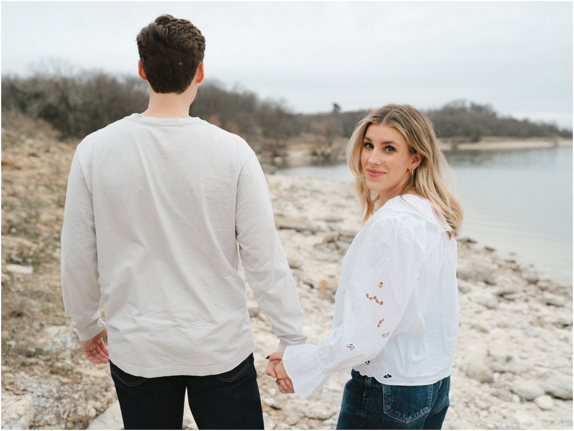 couple walking together near the lake in fort worth texas engagement session