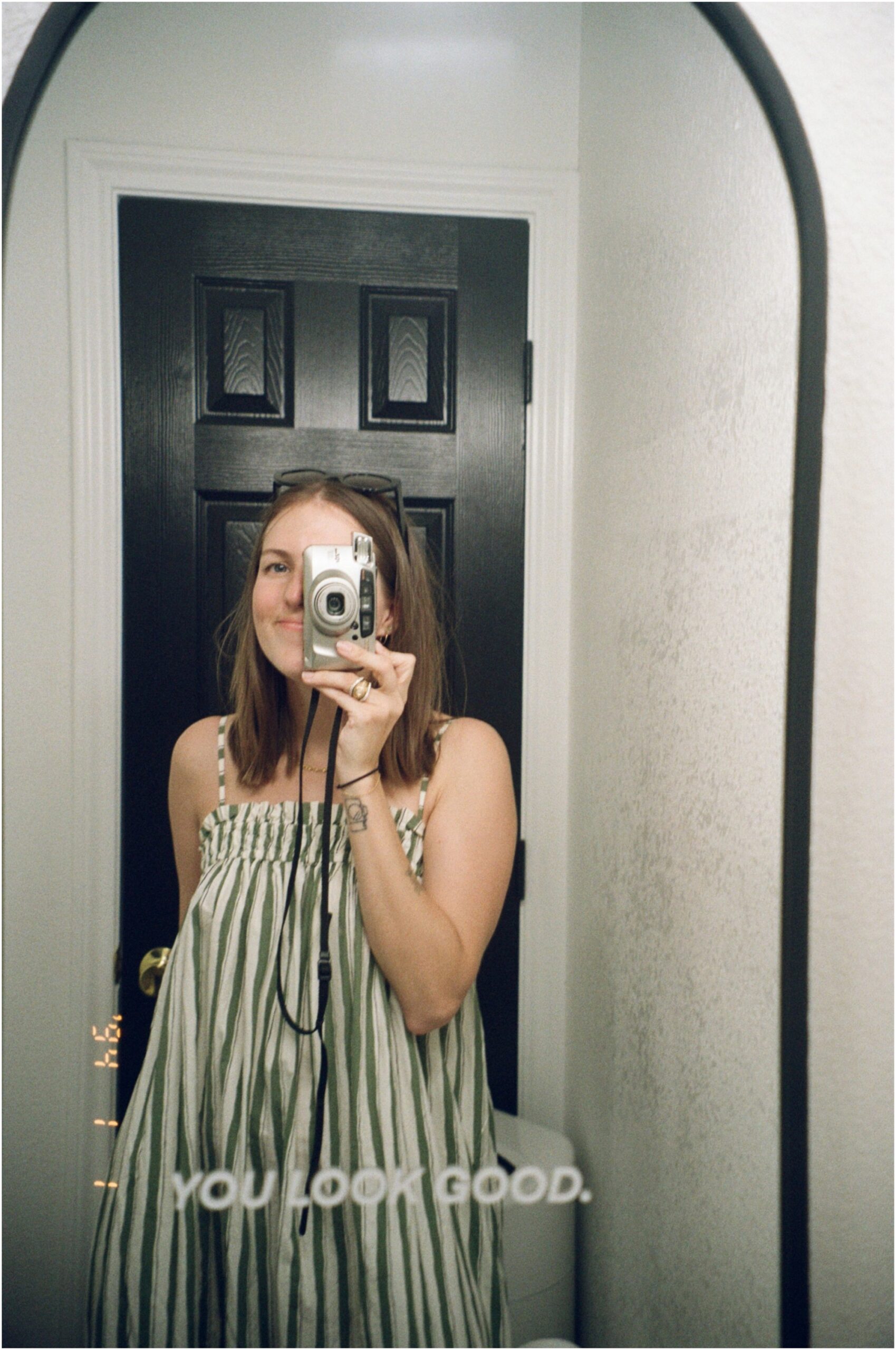 mirror selfie with a 35mm film camera