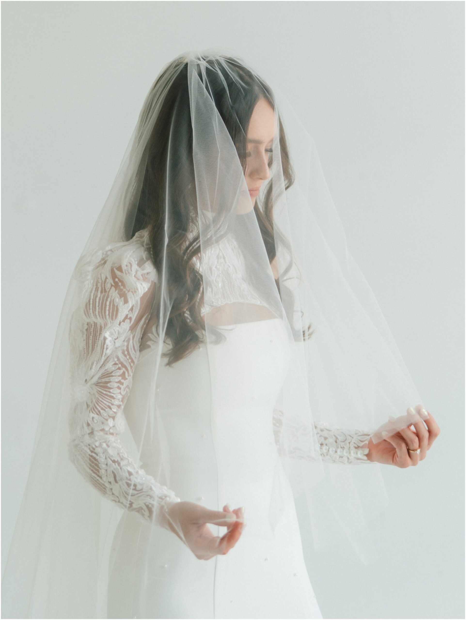 bride with veil over face