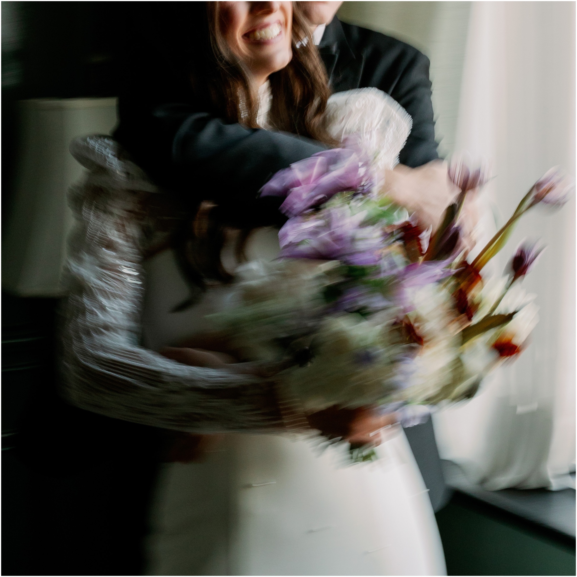 bride and groom portraits blurry with colorful flowers