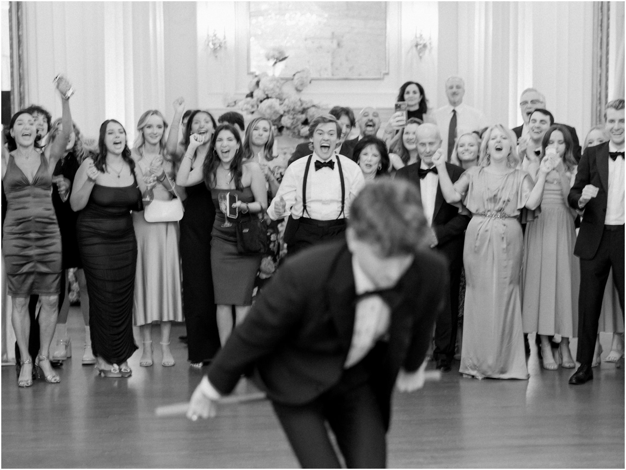 groom does stick dance at wedding reception