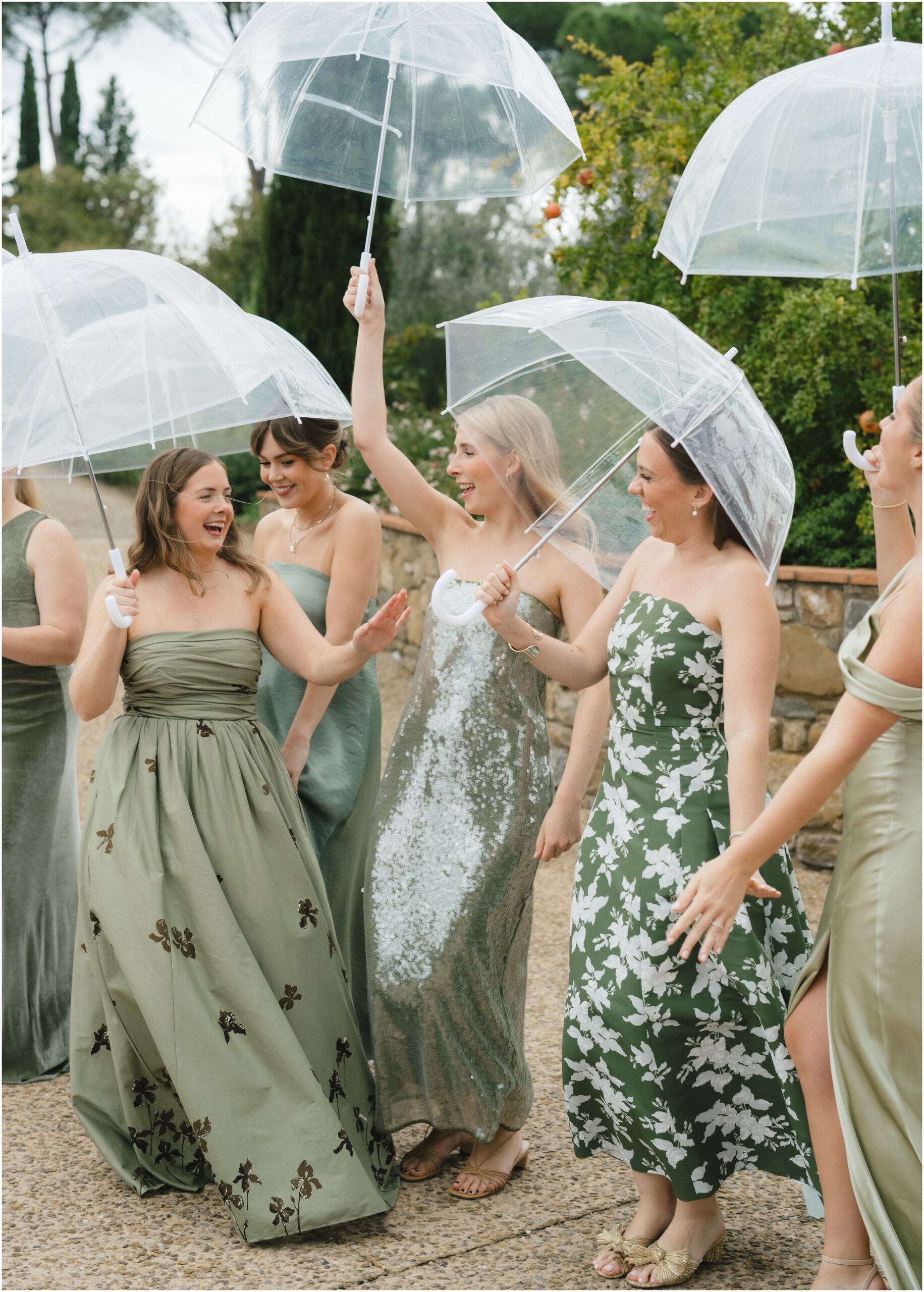 bridesmaids in italy wearing mix-matched green dresses